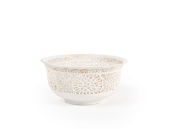 A RARE DEHUA PIERCED CUP