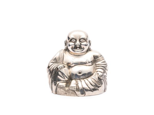 A SMALL SILVER LAUGHING BUDDHA