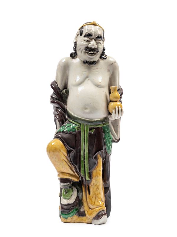 A FAMILLE VERTE PORCELAIN FIGURE OF A LUOHAN