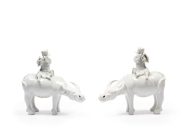 A PAIR OF DEHUA PORCELAIN BOYS AND WATER BUFFALOES