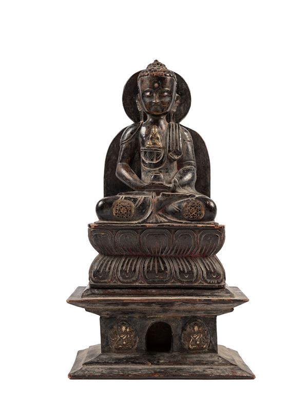 A WOODEN FIGURE OF SHAKYAMUNI BUDDHA