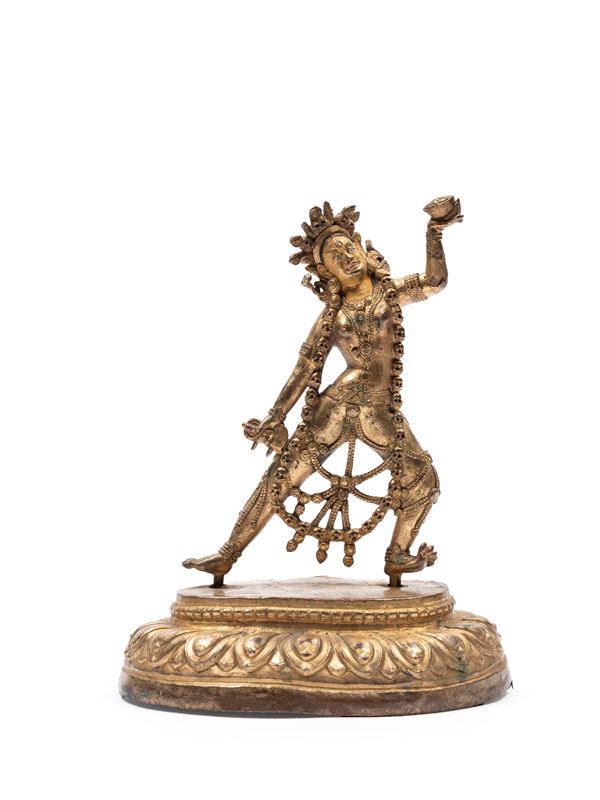 A GILT BRONZE FIGURE OF DAKINI