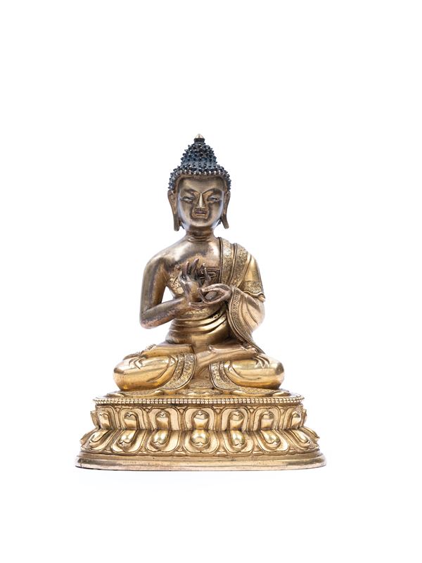 A GILT BRONZE FIGURE OF BUDDHA SHAKYAMUNI