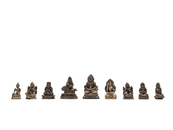 NINE SMALL BRONZE FIGURES
