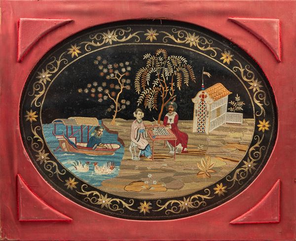 AN EMBROIDERED SILK