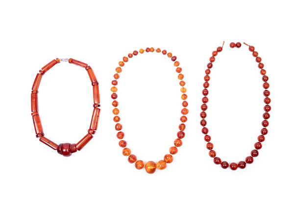 THREE AMBER NECKLACES