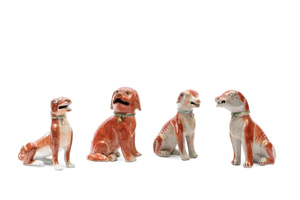 FOUR PORCELAIN FIGURES OF DOGS
