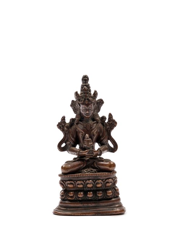 A BRONZE FIGURE OF AVALOKITESVARA