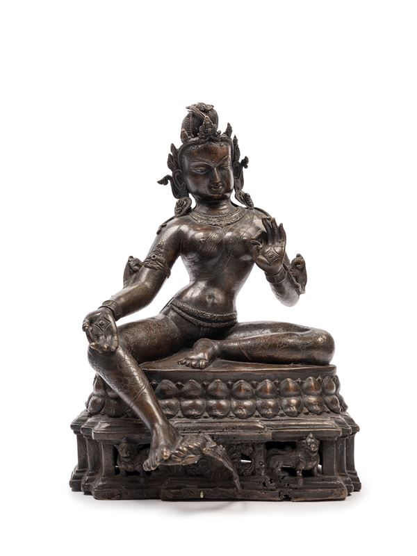 A BRONZE FIGURE OF TARA