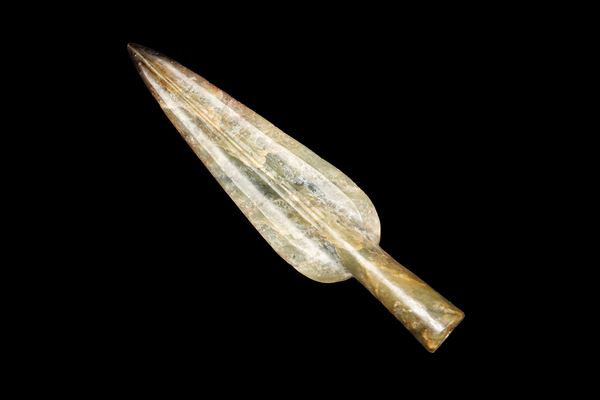 A CELADON-RUSSET JADE ARROWHEAD