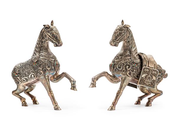 A PAIR OF SILVER HORSES