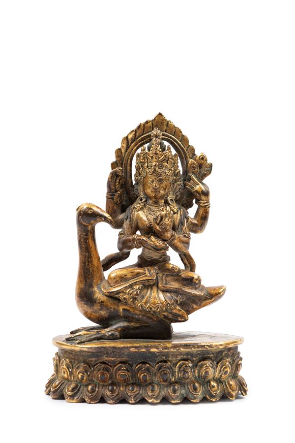 A GILT-BRONZE FIGURE OF SARASVATI