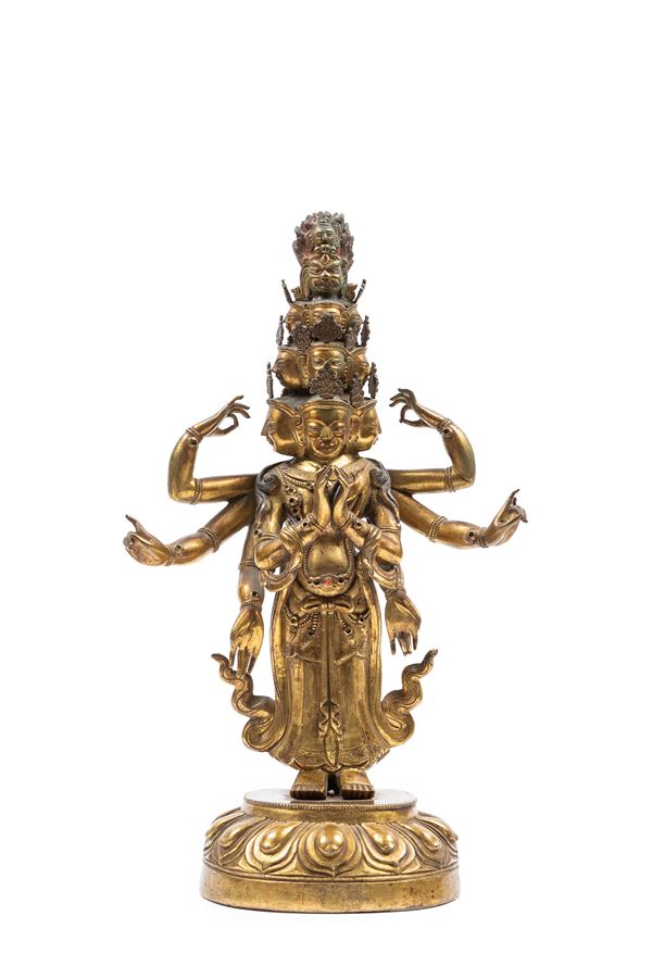 A GILT-BRONZE FIGURE OF EKADASHAMUKA AVALOKITESVARA