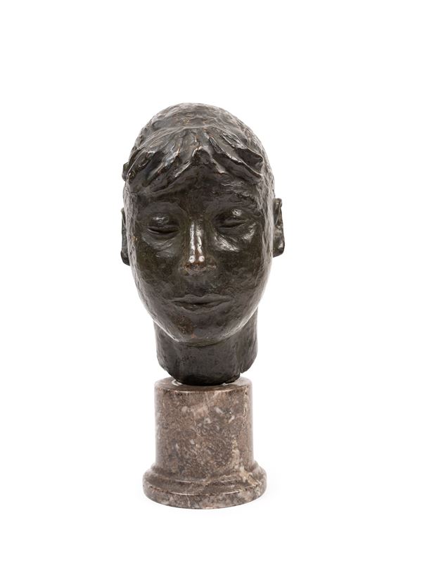 BRONZE SCULPTURE DEPICTING A WOMAN'S HEAD