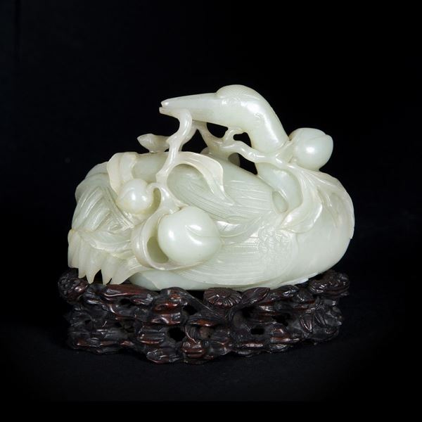 A PALE CELADON JADE CARVING OF A CRANE
