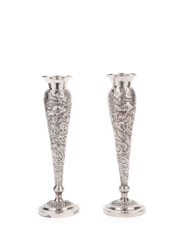 A PAIR OF SILVER FLOWER HOLDERS