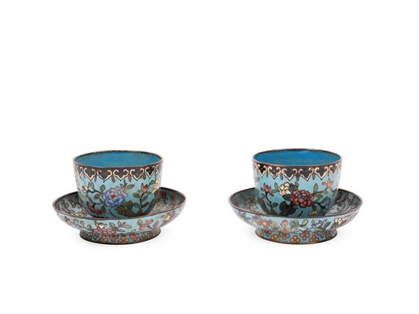 A PAIR OF CLOISONNÉ ENAMEL TEA CUPS AND SAUCERS