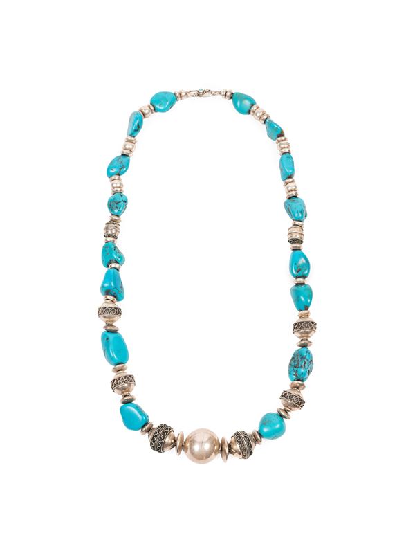 A SILVER AND TURQUOISE NECKLACE