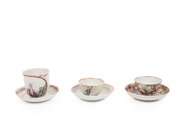 A PORCELAIN CUP AND TWO BOWLS WITH SAUCERS