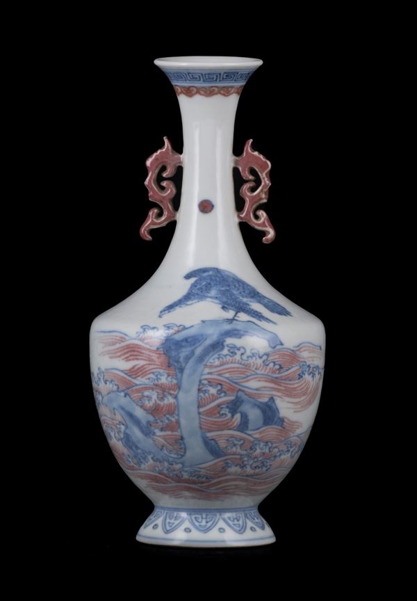 A SMALL UNDERGLAZE RED AND BLUE VASE