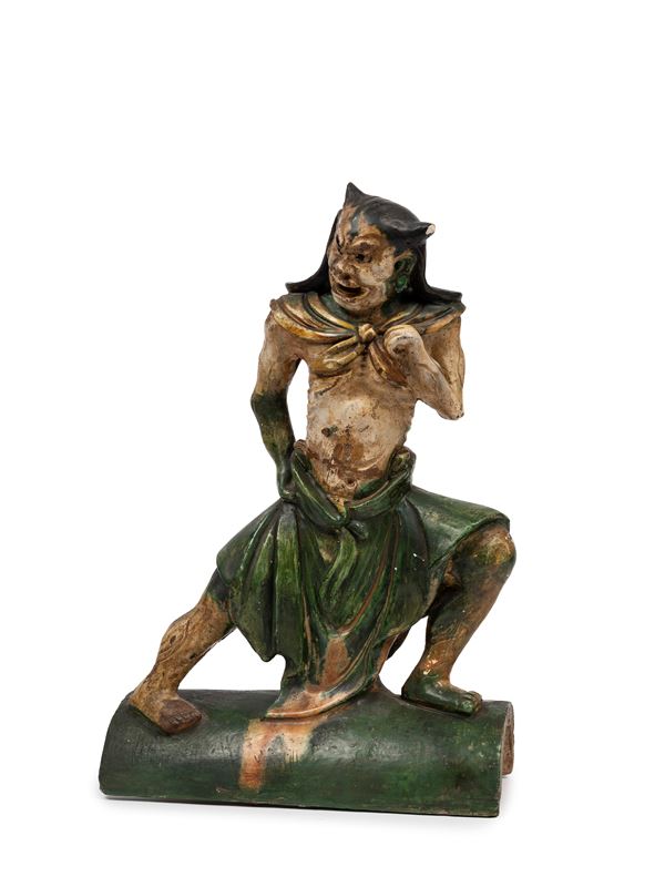 A 'SANCAI' EARTHENWARE RIDGE-TILE 