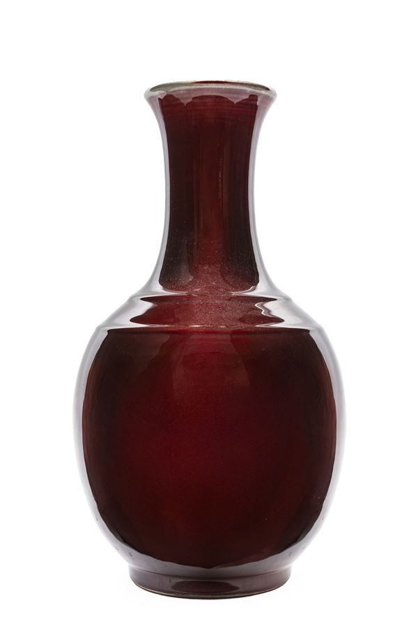 A RED-GLAZED VASE
