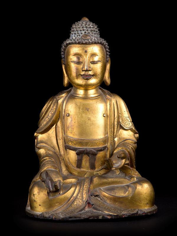 A GILT-BRONZE FIGURE OF SEATED BUDDHA