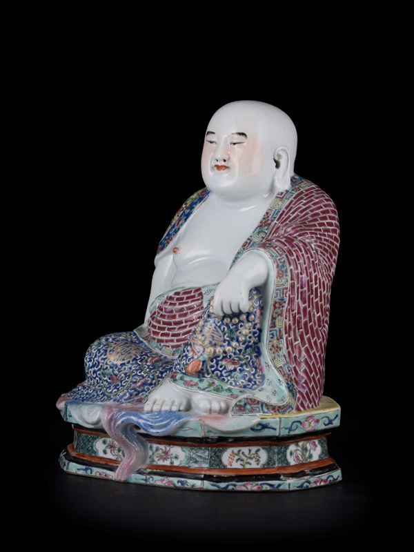 A RARE PORCELAIN SEATED BUDDHA MARKED BY WEI HONGTAI