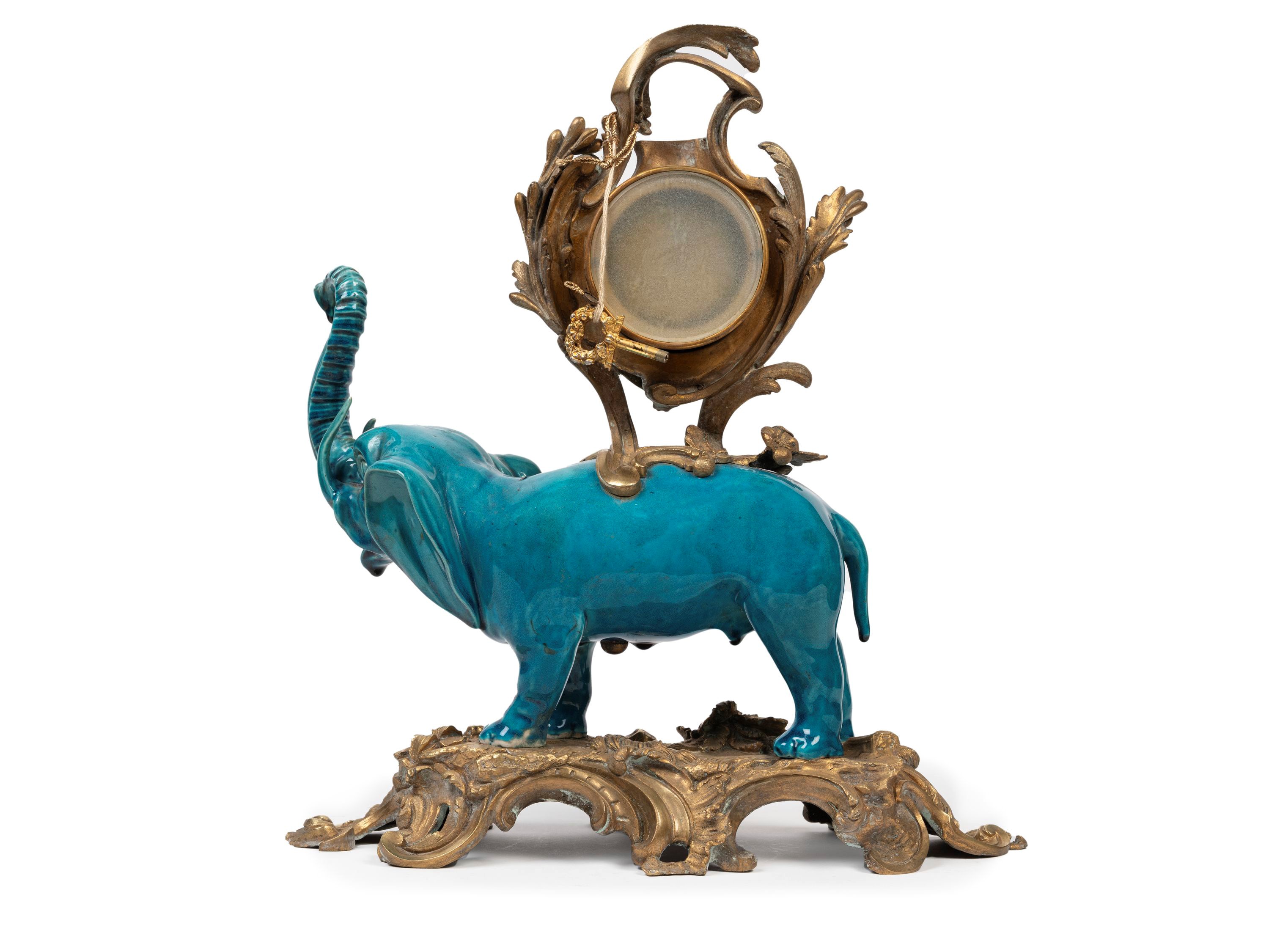 OROLOGIO DA TAVOLO CON ELEFANTE IN PORCELLANA MONTATO IN BRONZO