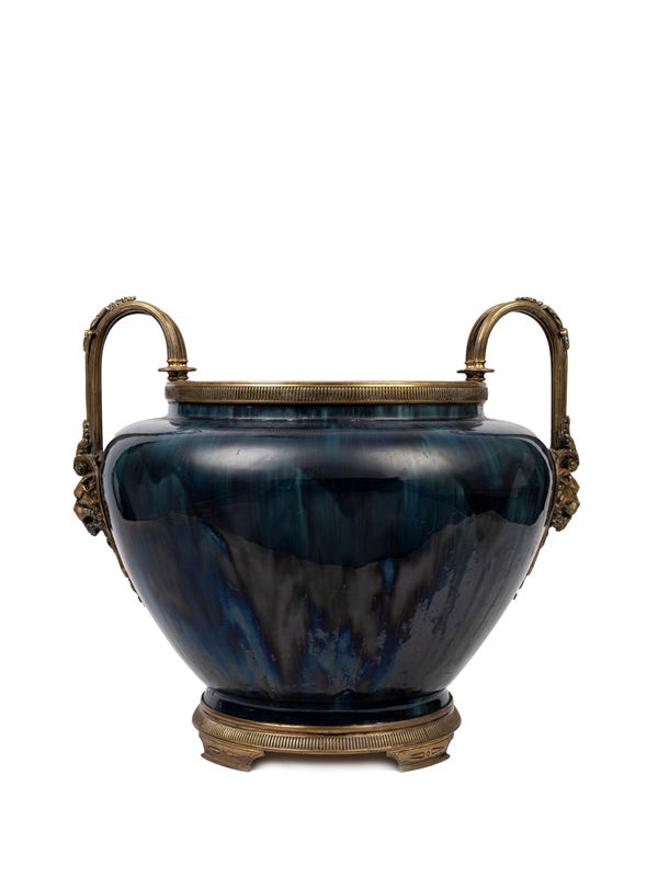 A LARGE PORCELAIN BOWL MOUNTED IN GILT BRONZE