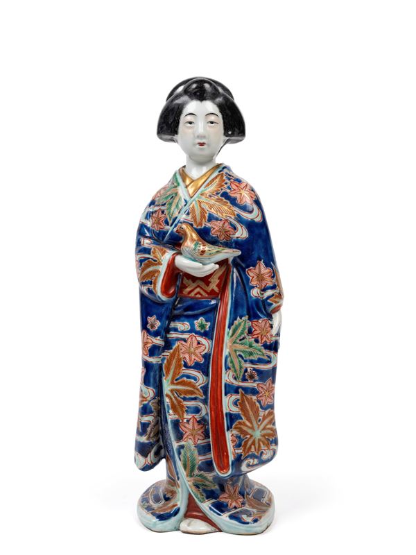 A KUTANI PORCELAIN FIGURE 