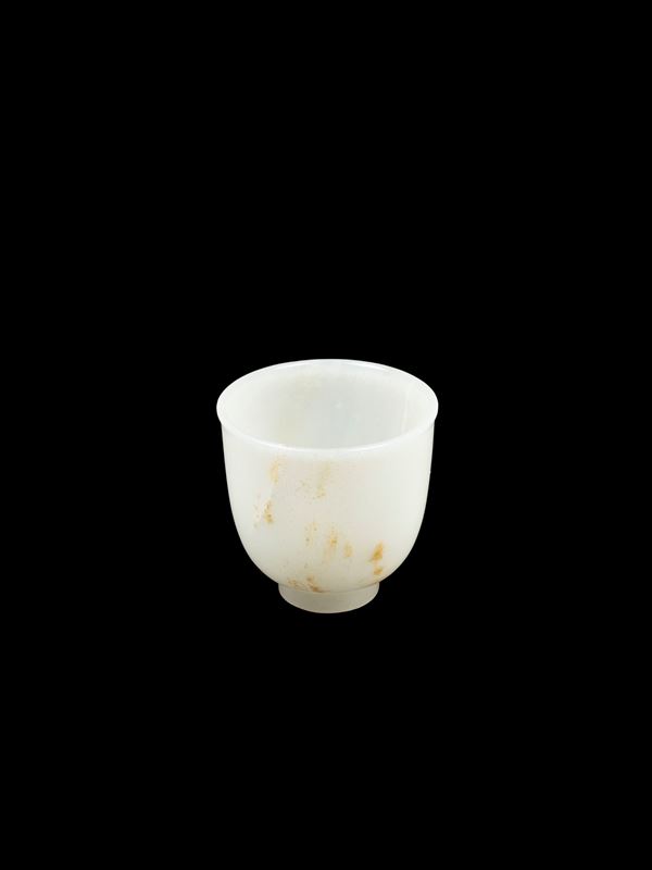 A WHITE AND RUSSETT JADE CUP