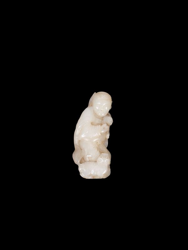 A WHITE JADE FIGURE