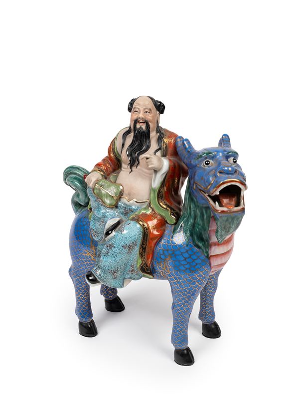 A FAMILLE ROSE PORCELAIN FIGURE