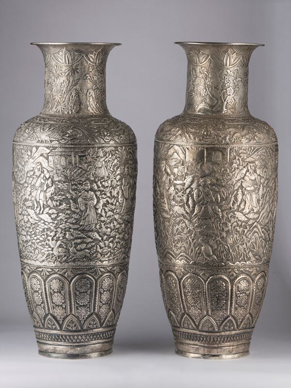 A PAIR OF SILVER VASES