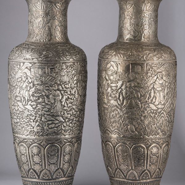 A PAIR OF SILVER VASES