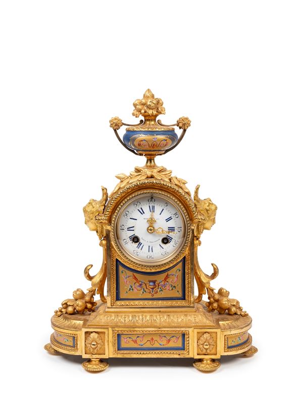 A GILT BRONZE TABLE CLOCK