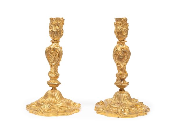 A PAIR OF GILT BRONZE CANDLESTICKS IN THE LOUIS XV STYLE.