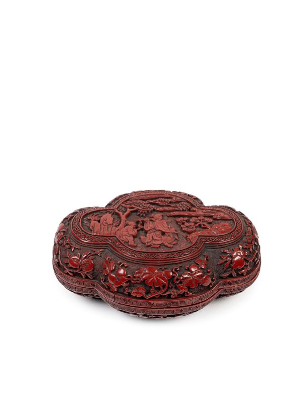A CINNABAR-LACQUER 'QUATREFOIL' BOX