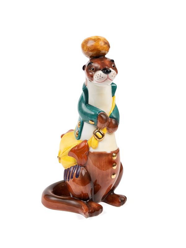 Lenci - POLYCHROME EARTHENWARE SCULPTURE DEPICTING FISHING OTTER WITH JACKET AND SHOULDER STRAP
