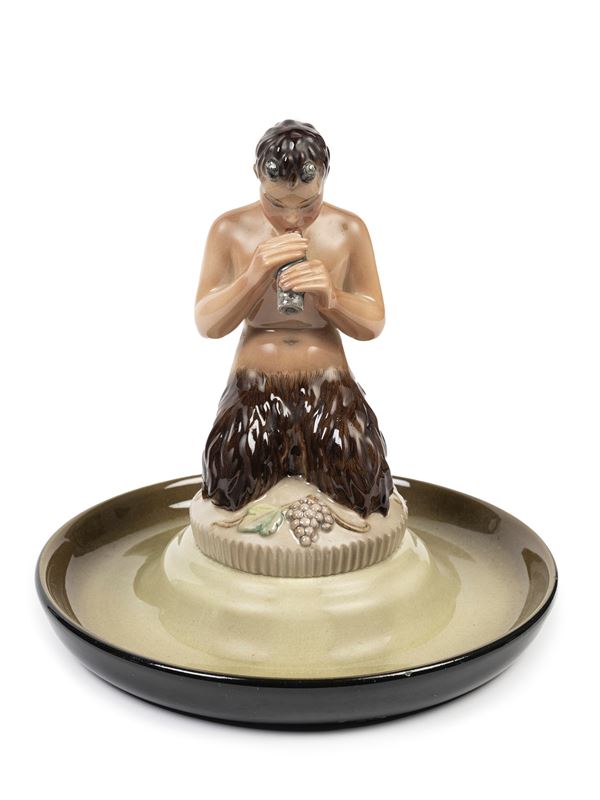 Lenci - POLYCHROME EARTHENWARE SCULPTURE DEPICTING FAUN PLAYING ON A PLATE