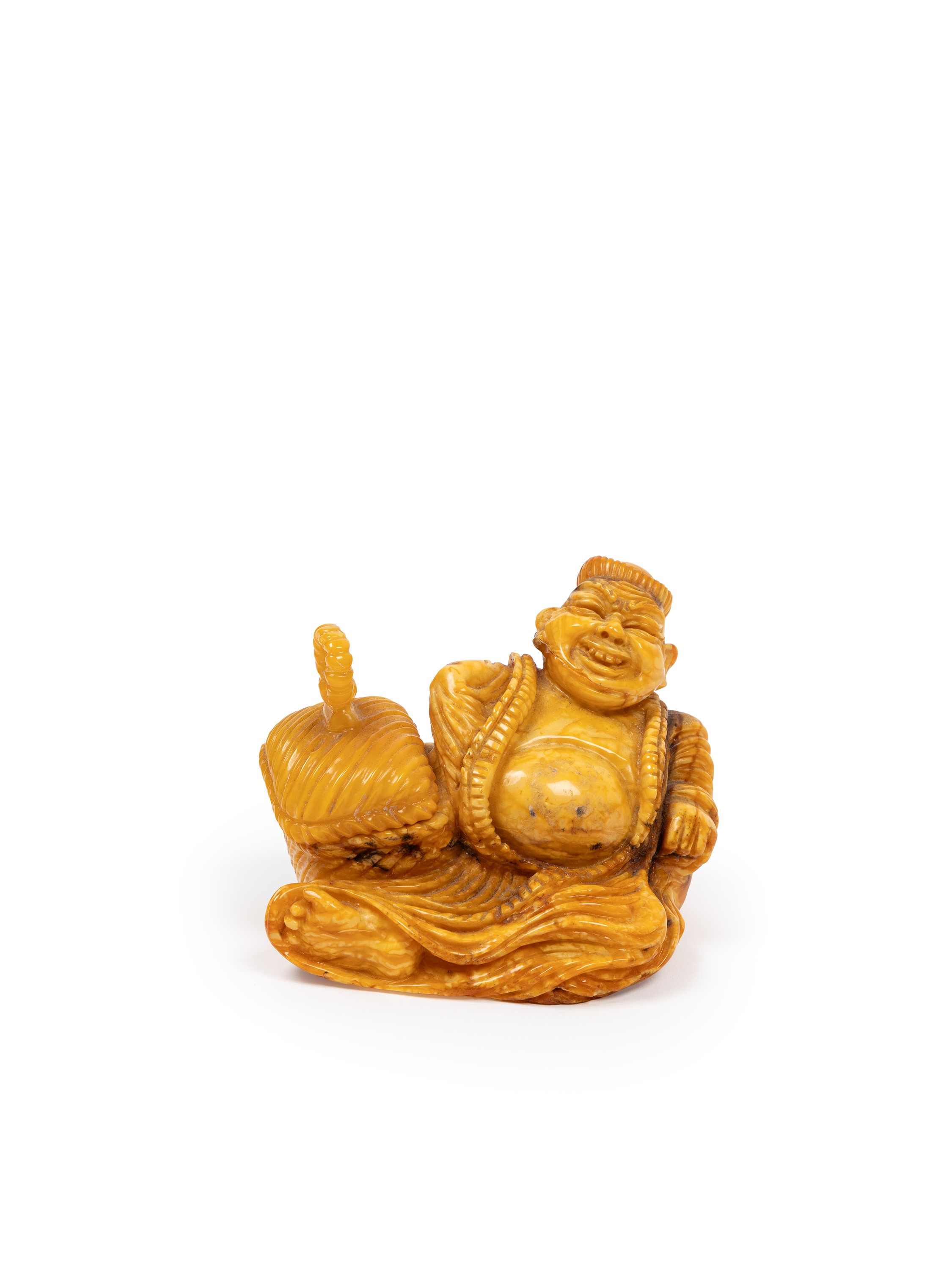 Scultura in ambra raffigurante un mercante, Cina, inizio XX secolo