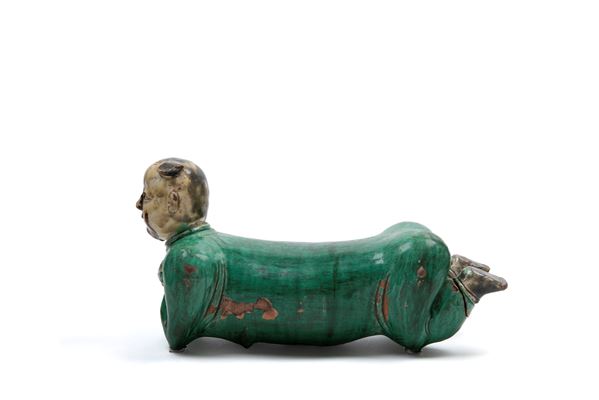 POLYCHROME SANCAI CERAMIC SCULPTURE DEPICTING A RECLINING CHILD