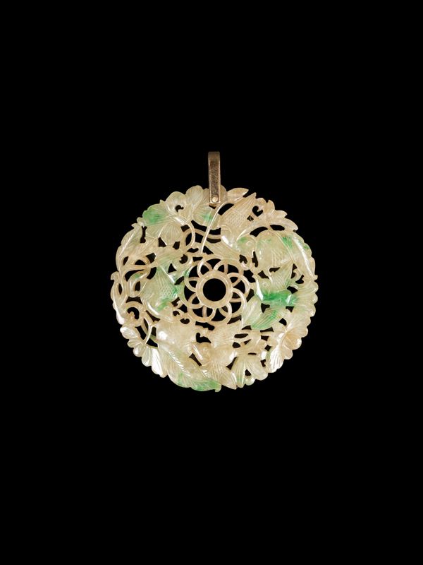 A CARVED OPENWORK JADEITE PENDANT