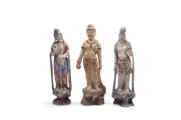 THREE POLYCHROME LACQUERED WOOD SCULPTURES DEPICTING TWO GUANYIN FIGURES AND ONE MALE FIGURE