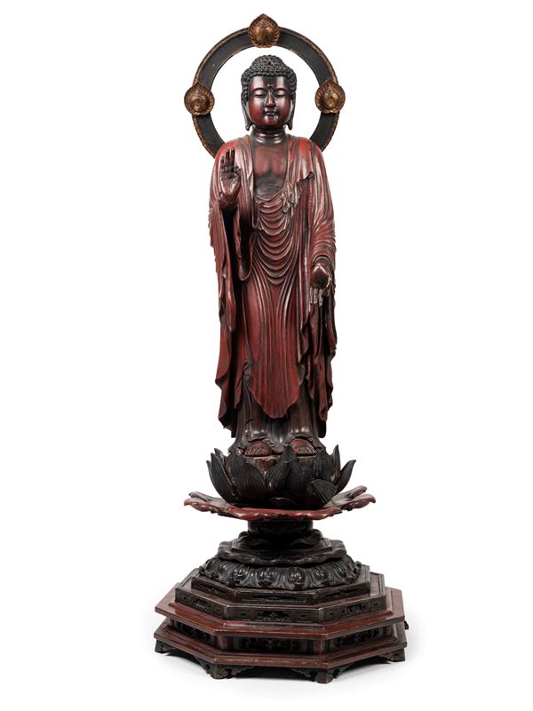 A LARGE RED WOOD BUDDHA