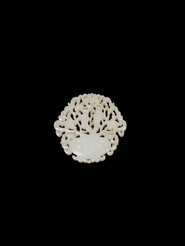 A SMALL CARVED WHITE JADE