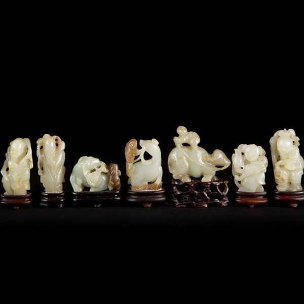 A GROUP OF NINE CARVED JADE FIGURES AND ANIMALS