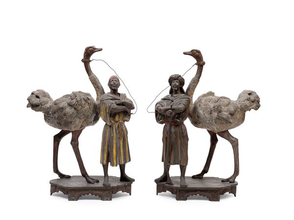 PAIR OF METAL SCULPTURES DEPICTING BEDOUINS WITH OSTRICHES