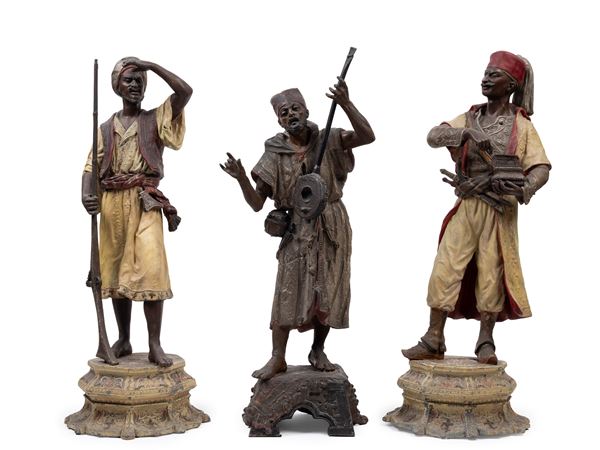 THREE ORIENTALIST METAL SCULPTURES DEPICTING MALE FIGURES